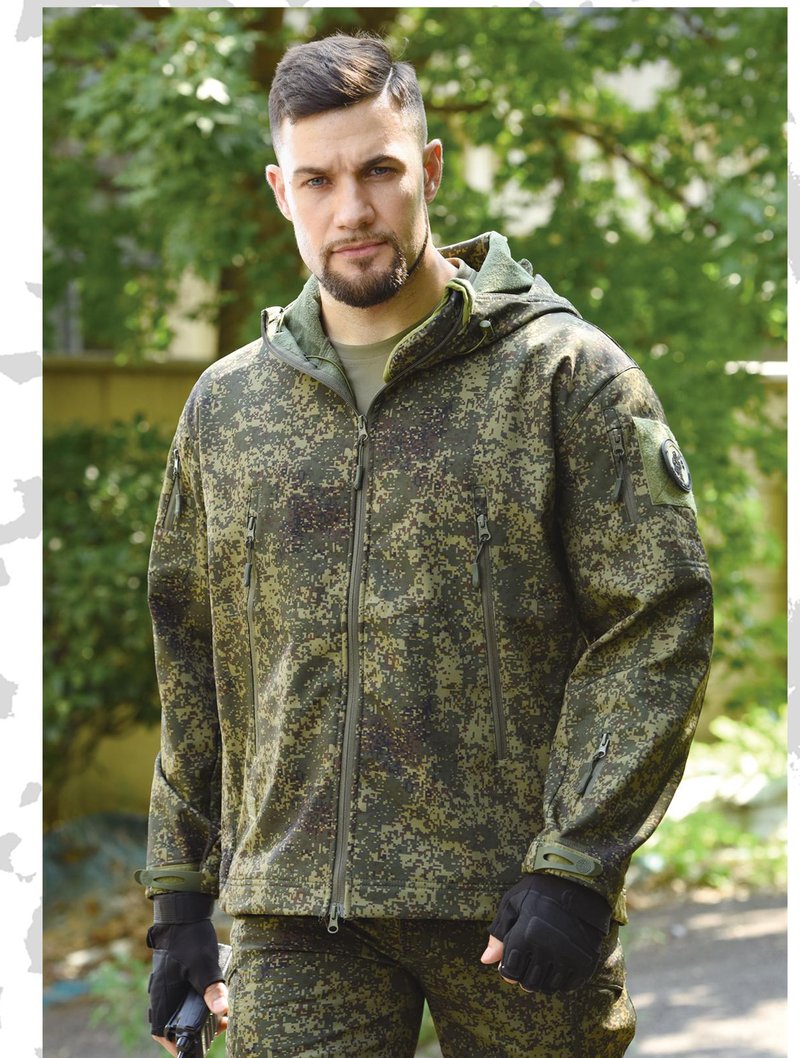 Model wearing camouflage softshell jacket