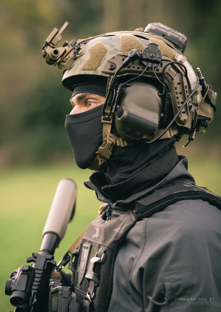Operator wearing helmet-mounted tactical headset
